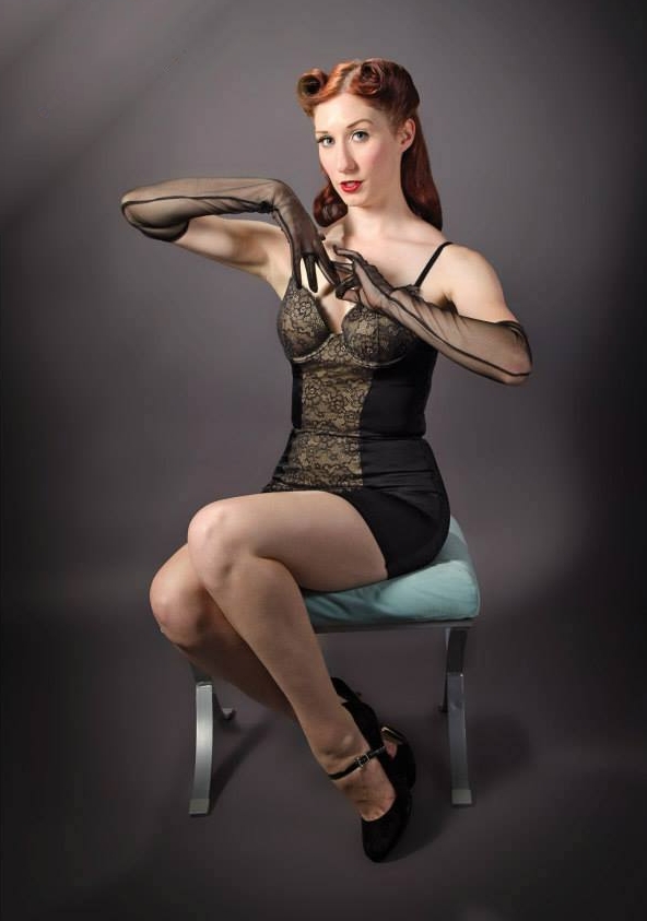 Redhead Pin Up Girl with Bare Legs wearing Black Short Dress